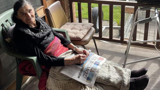 Yiannoula Darmos relaxing on her porch.