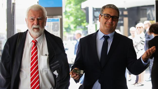 Wayne William Downey leaves court with his legal team. Picture: Gaye Gerard