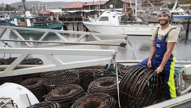 Cray fisher Riley Jemison prepares to head out onboard the William Norling at Hobart battling raining and stormy conditions. Picture: Chris Kidd