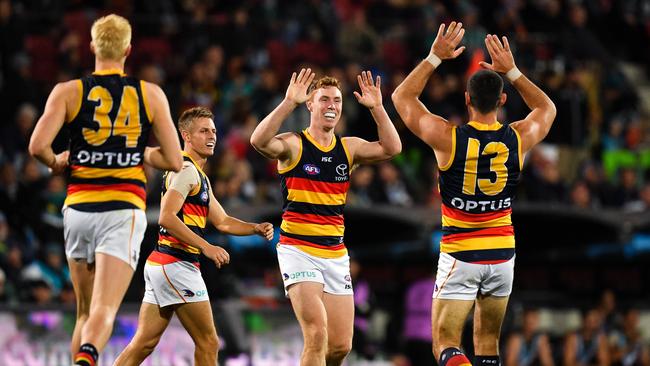 Adelaide’s Tom Lynch and Taylor Walker celebrate a goal in the Showdown win over Port Adelaide on Saturday night. Picture: Daniel Kalisz/Getty Images