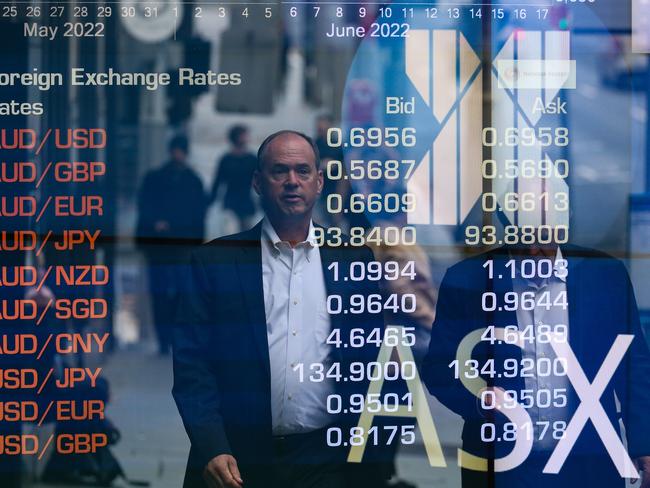 SYDNEY, AUSTRALIA - NEWSWIRE PHOTOS June 20 2022: A general view of people walking past the Australian Stock Exchange in Sydney ahead of the budget announcement. Picture NCA Newswire/ Gaye Gerard.