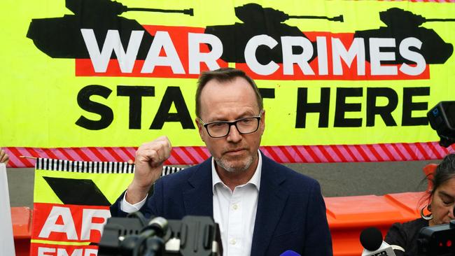 MELBOURNE AUSTRALIA - NewsWire Photos SEPTEMBER 13, 2024: Greens Senator David Shoebridge  addresses anti-war protesters outside the Land Forces event in Melbourne, rallying against the military expo and voicing concerns over Australia's involvement in the global arms trade. Picture: NewsWire / Luis Enrique Ascui