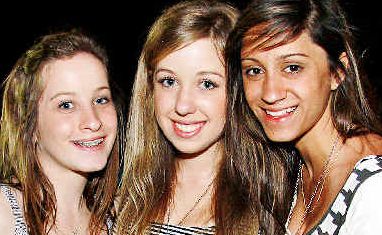 Big spenders: Melbourne schoolies Fiona Moreillon (left), 18, Julia Tumolero, 17, and Estelle Lopes, 17, enjoying a funfilled, if expensive, holiday in Byron Bay. . Picture: Patrick Gorbunovs