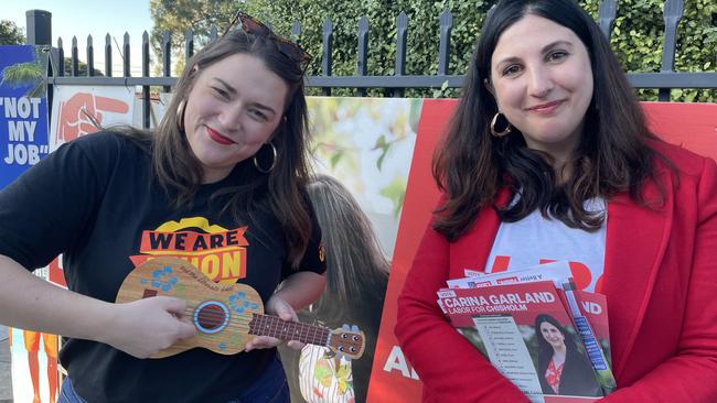 Labor Chisholm candidate Carina Garland with Unionist Claire Boland giving out anti-Scott Morrison ukulele shaped pamphlets at Mount View Primary School in Glen Waverley. Picture: Kiel Egging.