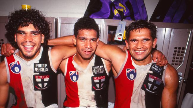 Dale Kickett, Gilbert McAdam and Nicky Winmar of the St Kilda Saints pose following an AFL match, 1990