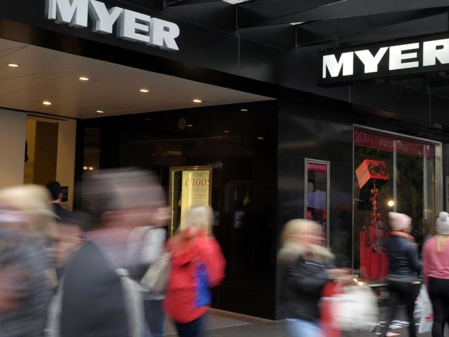 Pedestrians walk past Myer in the Bourke Street Mall in Melbourne, Friday, May 2, 2014. Myer shares fell sharply after the retailer reported a slight decline in total sales for the third quarter. (AAP Image/Julian Smith) NO ARCHIVING