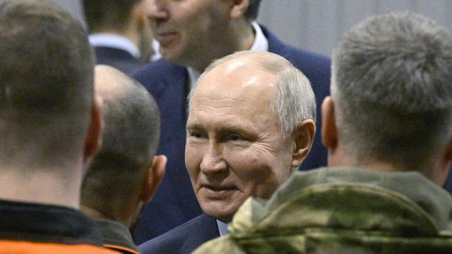 Vladimir Putin ‘couldn’t hold back his smile’ as he visited a factory in the Urals region, a critic said. Picture: POOL / AFP