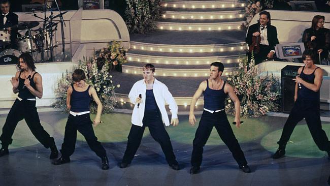 Robbie Williams performs with Take That. Picture: Getty Images