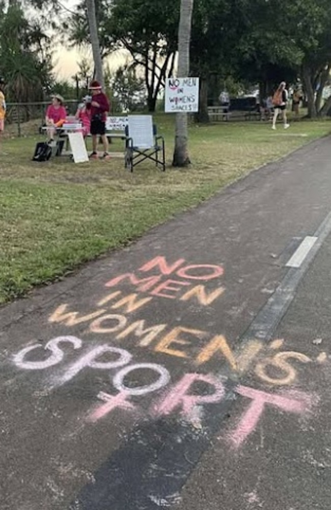 “No men in women’s sport” was written in chalk towards the finish line of the fun run. Picture: Contributed