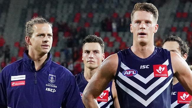 Nat Fyfe (left) and Matt Taberner of the Dockers leave the field following the Round 4 AFL match between the Gold Coast Suns and the Fremantle Dockers at Metricon Stadium on the Gold Coast, Saturday, June 27, 2020. (AAP Image/Dave Hunt) NO ARCHIVING, EDITORIAL USE ONLY