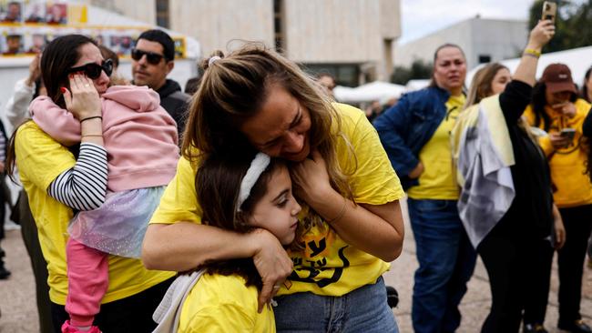 Relatives and friends of Israeli hostages held by Hamas militants in the Gaza Strip react as they watch the release of four women soldiers. Picture: John Wessels / AFP