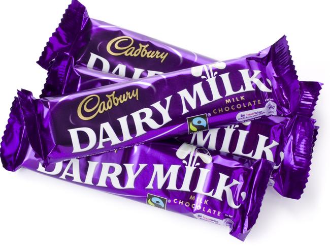 St Ives, England - August 15, 2011: Four 40g Cadbury Dairy Milk Chocolate Bars isolated on a white background.