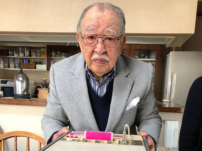 Shigeichi Negishi in 2018 with his karaoke machine from the 1960s, called the Sparko Box. PHOTO: MATT ALT