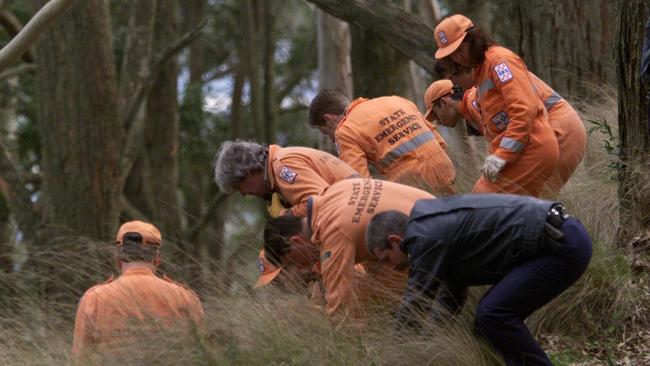 SES volunteers and police search the Mount Buninyong scene where the body of Belinda Williams was found.