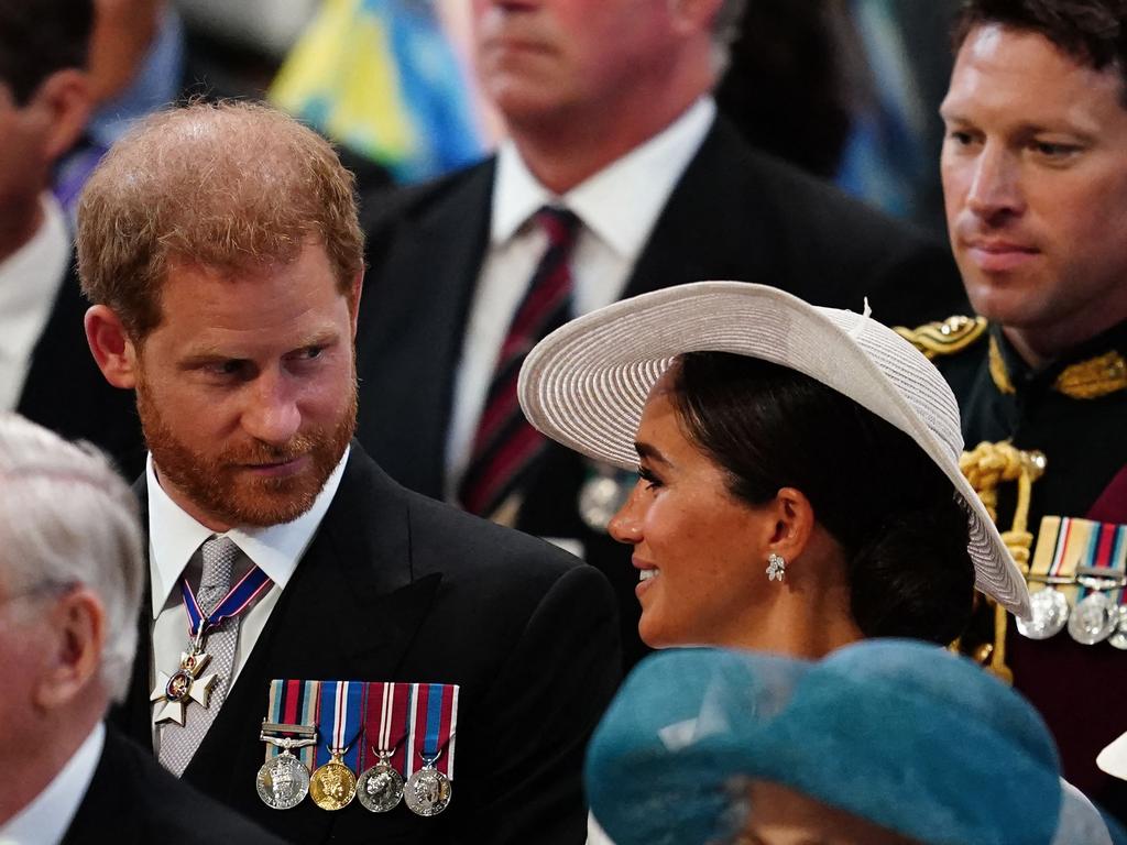 The Sussexes were seated together in a second row. Picture: AFP