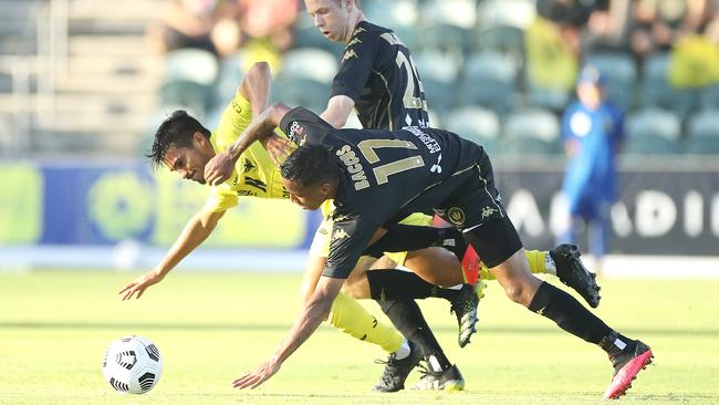 Wellington’s Ulises Davila is fouled by Keanu Baccus of the Wanderers at WIN Stadium