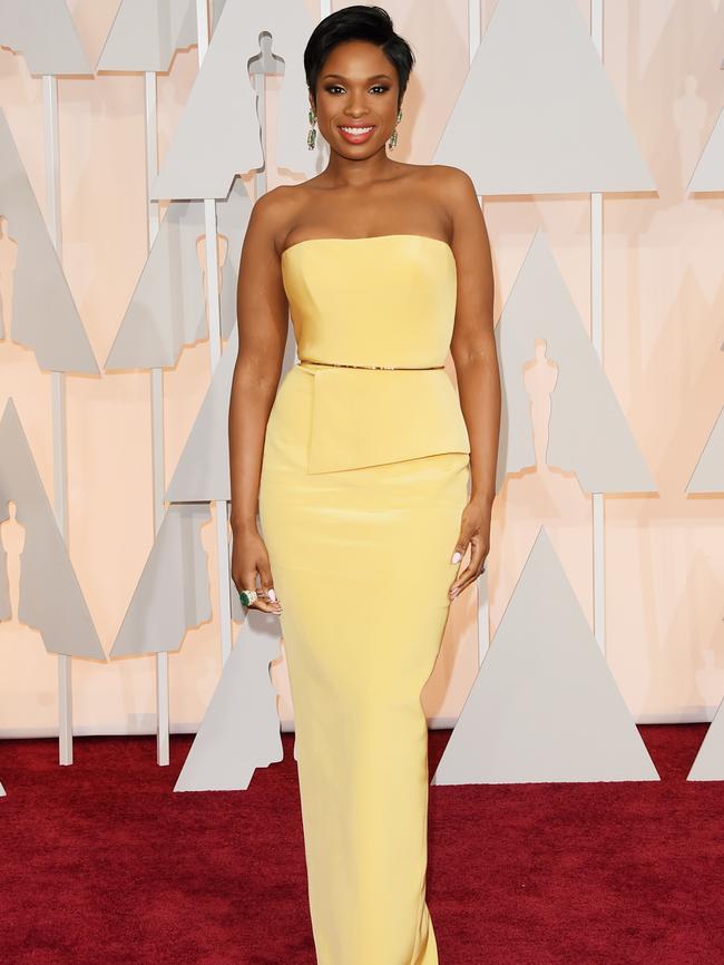 Lovely in yellow ... Jennifer Hudson arrives on the red carpet. Picture: Getty Images