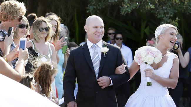 Allan Langer walks daughter Maddison Langer down the aisle at Dicky Beach. Picture: Megan Slade.