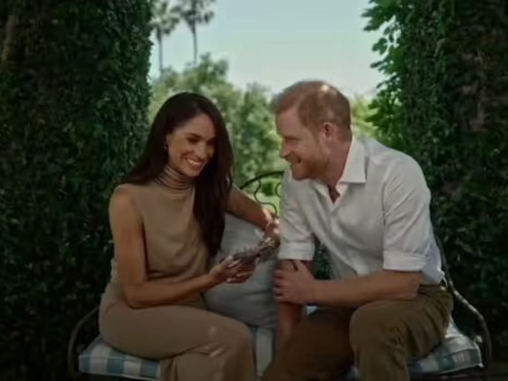 Meghan Markle and Prince Harry in matching beige, in what appears to be the garden of their California home. Picture: Supplied