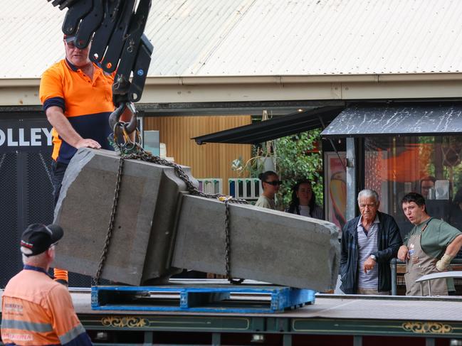 The John Batman statue is removed from the Queen Victoria Market. Picture: Brendan Beckett