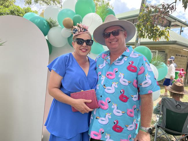 A couple having a ball at the Torbanlea Picnic Races.