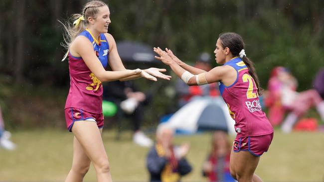 Courtney Hodder, right, of the Lions celebrates a goal. (Photo by Russell Freeman/AFL Photos via Getty Images)