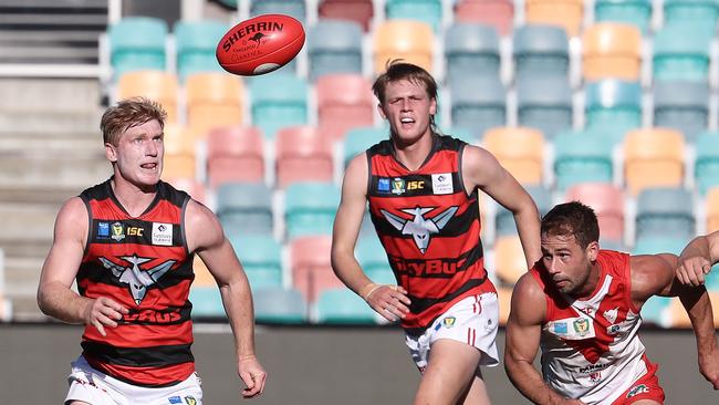 Lauderdale's Bryce Walsh (left) about to take possession of the ball in a Clarence vs Lauderdale match at Blundstone Arena. Picture: LUKE BOWDEN