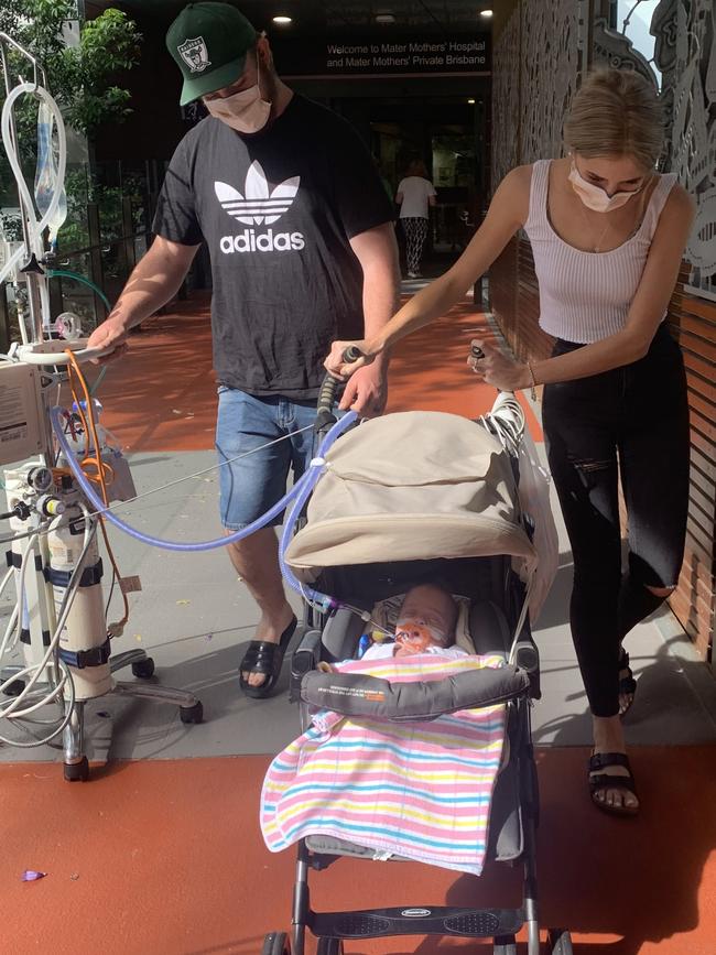 Ollie and his parents leaving Mater Mothers' Hospital.