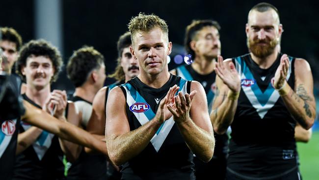 ADELAIDE, AUSTRALIA - APRIL 05:   Dan Houston of the Power   leads his team off during the round four AFL match between Port Adelaide Power and Essendon Bombers at Adelaide Oval, on April 05, 2024, in Adelaide, Australia. (Photo by Mark Brake/Getty Images)