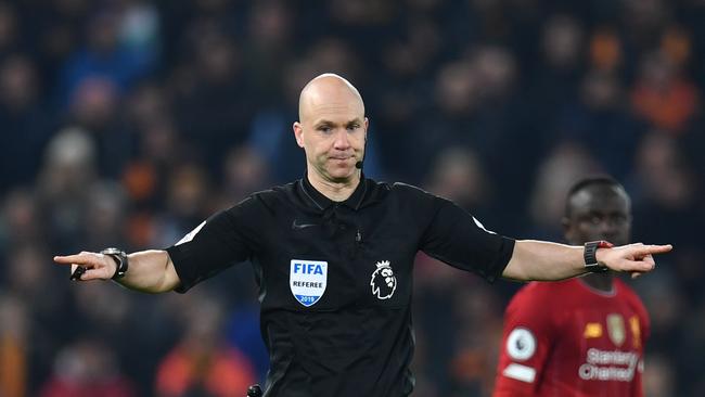 Referee Anthony Taylor gestures to have a VAR decision which led to Wolverhampton’s goal being ruled out. Picture: AFP