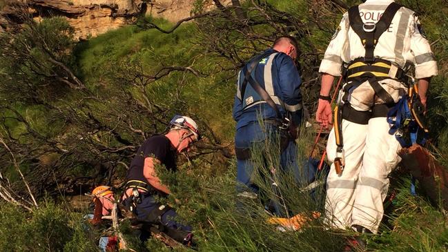 The rescue team attending to Isaac where he landed after falling 35m. Picture: NSW Ambulance Media