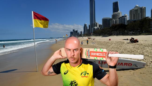 Chris Lynn poses for a photograph on the beach at Surfers Paradise on the Gold Coast ahead of Saturday’s T20 international at Metricon Stadium. Picture: AAP Image