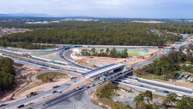 Spaghetti junction from the air shows the Logan Motorway and Gateway Motorway with the Mt Lindesay Highway in the background. 