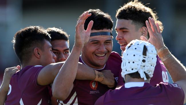 QLD's Arama Hau celebrates his try with teammates during the under 18 ASSRL schoolboy rugby league championship grand final between QLD v NSW CHS from Moreton Daily Stadium, Redcliffe. Picture: Zak Simmonds