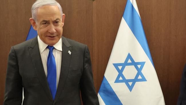 Israeli Prime Minister Benjamin Netanyahu (L) takes a seat before his meeting with France's Foreign Minister Stephane Sejourne (R) in Jerusalem on February 5, 2024. France's top diplomat's first Middle East trip as foreign minister aims at pushing for a ceasefire in Gaza and the release of hostages held by the Palestinian Hamas movement since October 7, a ministry spokesman said. (Photo by GIL COHEN-MAGEN / POOL / AFP)