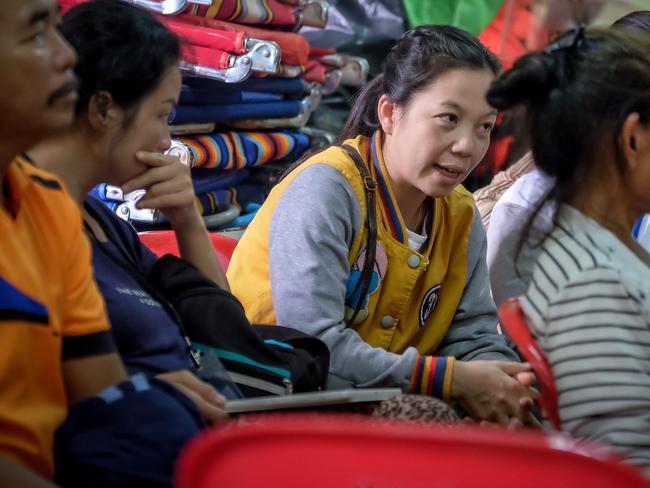 Family members of the missing children and their coach gather at Khun Nam Nang Non Forest Park. Picture: AFP