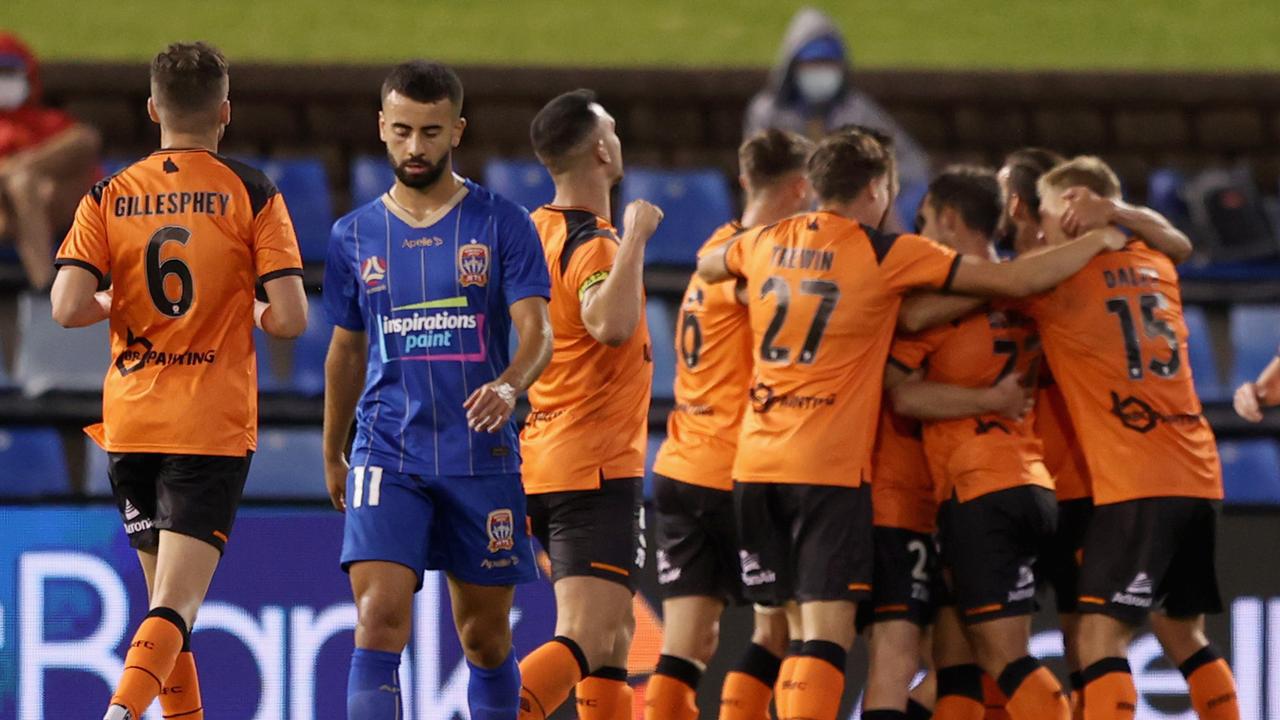 Dylan Wenzel-Halls of the Roar celebrates his goal with team mates during the A-League match between the Newcastle Jets and the Brisbane Roar at McDonald Jones Stadium.