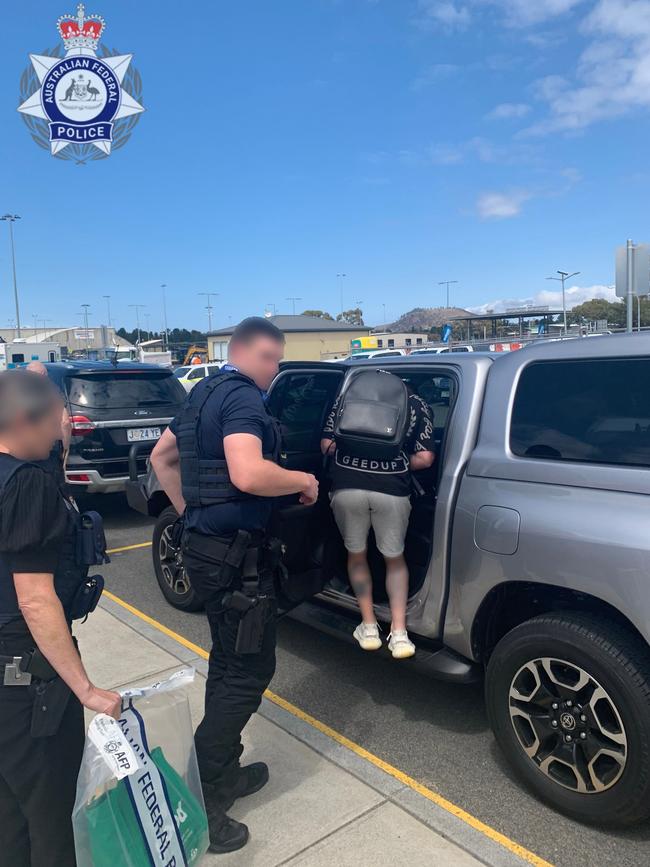 A 38-year-old Alexandria man being arrested at Hobart Airport on Thursday, November 9, 2023. Picture: AFP/ Tasmania Police