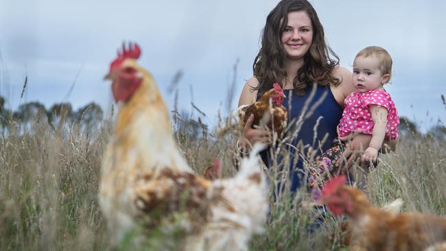 Madelaine Scott and her daughter Thora with free range organic chickens. Picture: Zoe Phillips