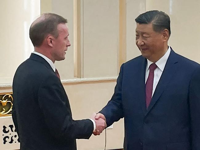 TOPSHOT - US National Security Advisor Jake Sullivan (L) shakes hands with China's President Xi Jinping during their meeting at the Great Hall of the People in Beijing on August 29, 2024. (Photo by Trevor Hunnicutt / POOL / AFP)