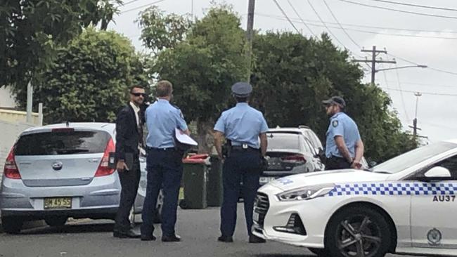 Police converge on Ettalong St, Auburn. Picture: Joanne Vella