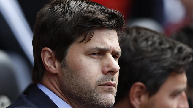 Southampton's manager Mauricio Pochettino looks on from the dugout before the start of their English Premier League soccer match against Manchester United at St Mary's stadium, Southampton, England, Sunday, May 11, 2014. (AP Photo/Sang Tan)