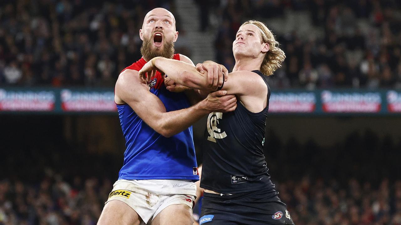 Melbourne, Australia. 02nd June, 2023. Alex Cincotta of Carlton tackles  Kysaiah Pickett of Melbourne during the AFL Round 12 match between the  Melbourne Demons and the Carlton Blues at the Melbourne Cricket