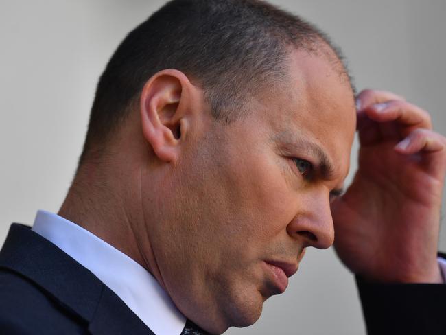 CANBERRA, AUSTRALIA - MARCH 22: Treasurer Josh Frydenberg reacts during a press conference at Parliament House on March 22, 2020 in Canberra, Australia. The second federal stimulus package unveiledÂ today by the Australian Government offers $66 billion worth of measures for coronavirus-hit economy including relief for retirees and a new wage for workers who lose their jobs and it builds on the measures included inÂ the first $17.6 billion economic stimulus packageÂ announced more than a week ago. There are now 1081 confirmed cases of COVID-19 In Australia while the death toll now stands at seven.  (Photo by Sam Mooy/Getty Images)