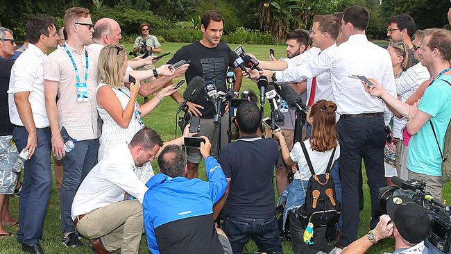 The media circle the sleep-deprived Federer. Picture: Ian Currie