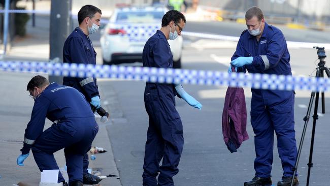 Police at the scene after the shooting tragedy. Picture: Andrew Henshaw