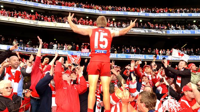 Kieren Jack celebrates Sydney’s grand final victory in 2012 with fans.