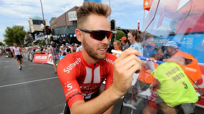 Chris Hamilton signs in at the start of stage 1 of the Tour Down Under in Adelaide, Tuesday, January 15, 2019. (AAP Image/Kelly Barnes) NO ARCHIVING, EDITORIAL USE ONLY