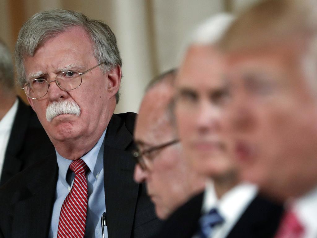 US National security adviser John Bolton, left, listens to US President Donald Trump, far right, who announced via Twitter that he was fired. Picture: AP