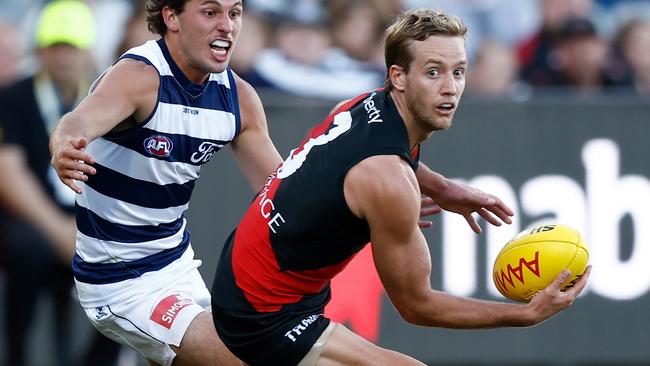 GEELONG, AUSTRALIA - MARCH 01: Darcy Parish of the Bombers and Jhye Clark of the Cats in action during the 2024 AFL AAMI Community Series match between the Geelong Cats and Essendon Bombers at GMHBA Stadium on March 01, 2024 in Geelong, Australia. (Photo by Michael Willson/AFL Photos via Getty Images)